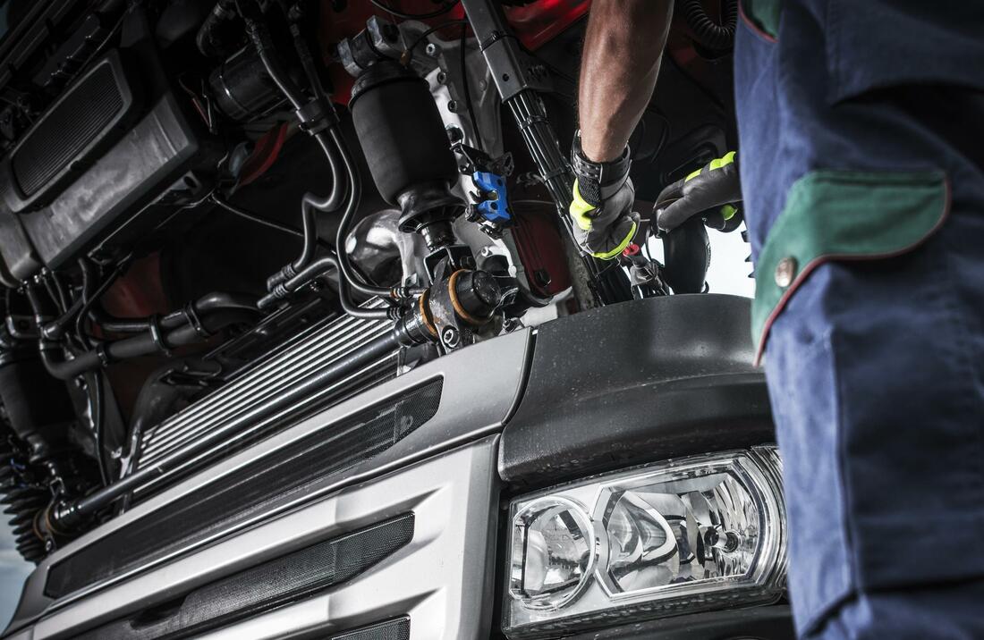 An expert servicing truck electrical and air system